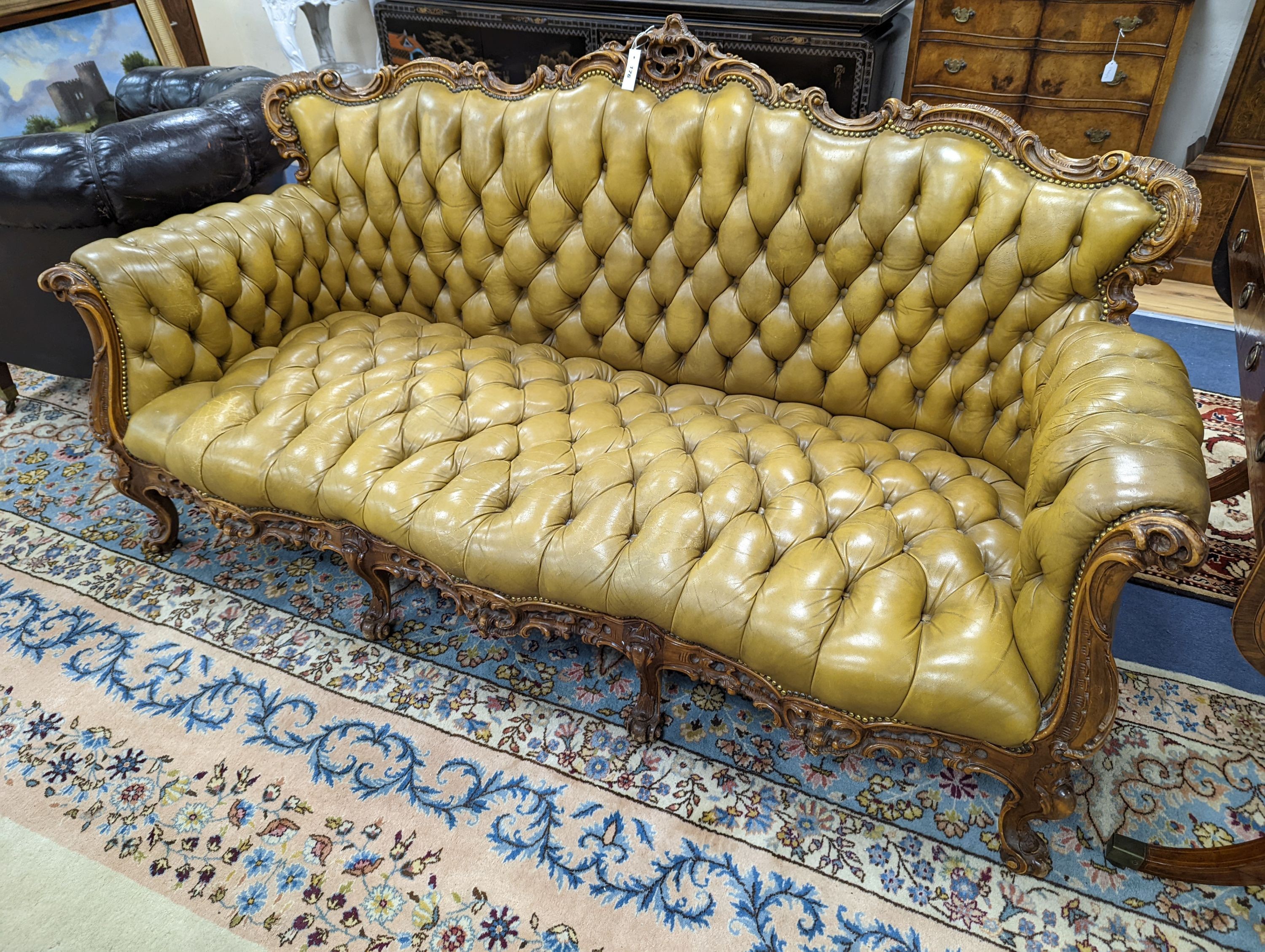 A Louis XVI design settee upholstered in buttoned olive leather, length 190cm, depth 70cm, height 99cm